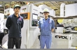 Сотрудники Mitsubishi рядом с установленой линией EVOL