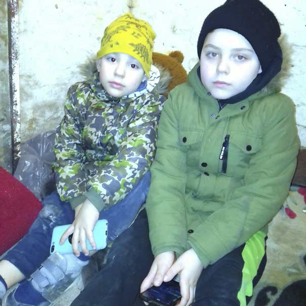 Gordii and Trokhym - sons of Victoria in a cellar while bombing